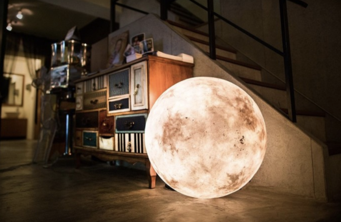 Luna moon-shaped lighting product illuminating a room