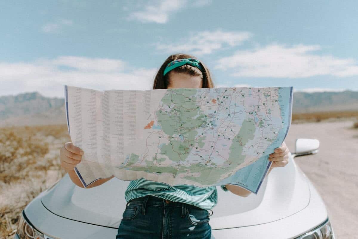 Person holding a map representing global reach of Kickstarter