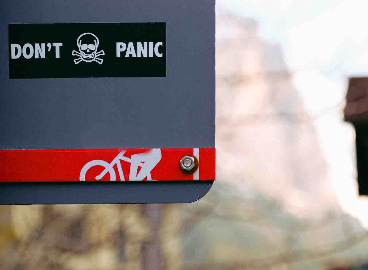 Don't Panic sign with skull icon - COVID-19 crowdfunding strategy guidance